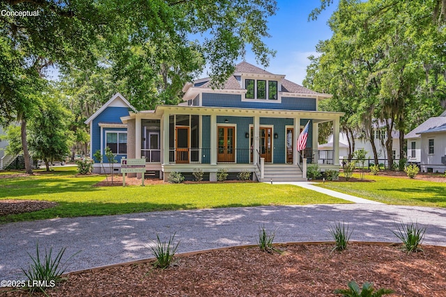213 Old Plantation Dr W, Beaufort, SC 29907 - view of front of house featuring a front yard, french doors, and a porch