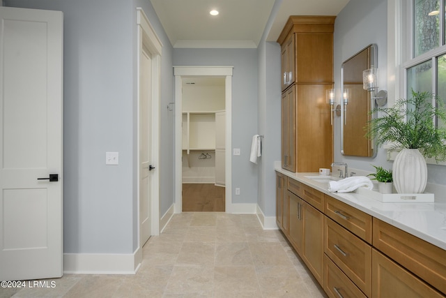 bathroom featuring vanity and ornamental molding