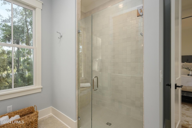 bathroom featuring tile patterned flooring and walk in shower