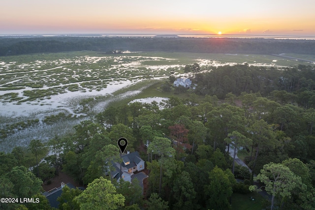 aerial view at dusk with a water view