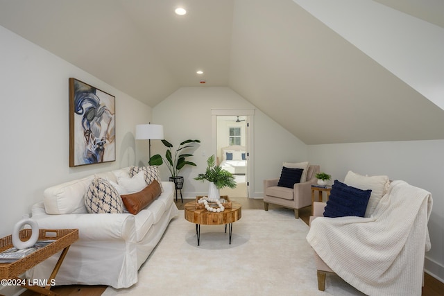 living room featuring lofted ceiling