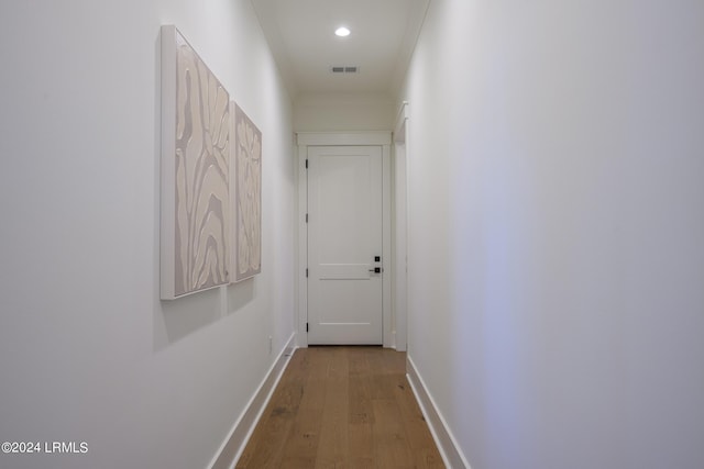 corridor with wood-type flooring