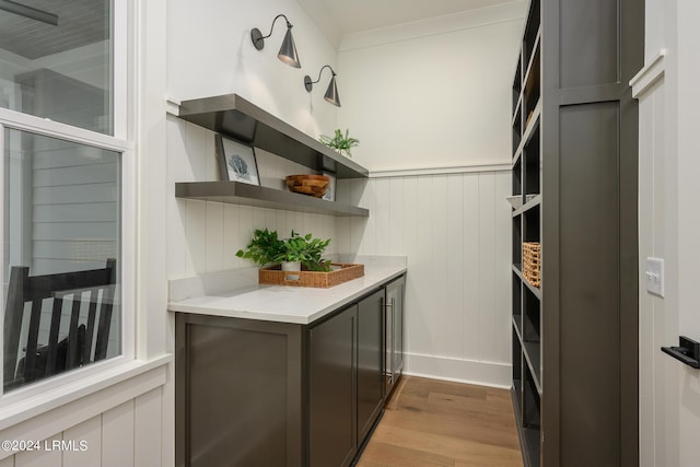 kitchen with wood-type flooring and light stone countertops