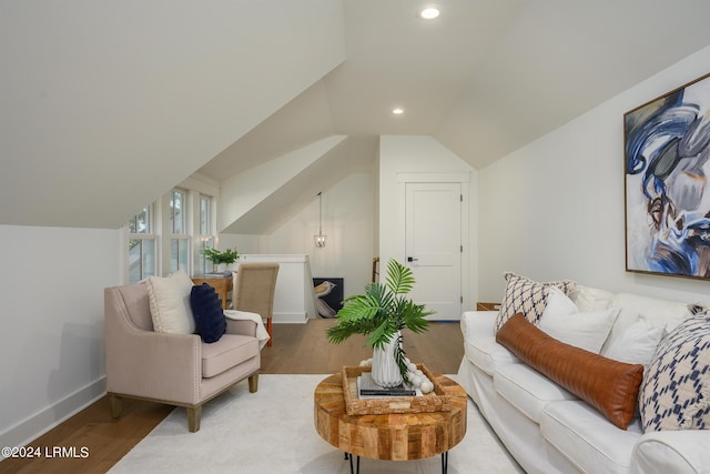 living room with wood-type flooring and lofted ceiling