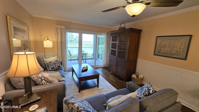 159 Beach Club Villa Dr Unit 159, Fripp Island, SC 29920 - living area featuring wood finished floors, a ceiling fan, a wainscoted wall, and ornamental molding