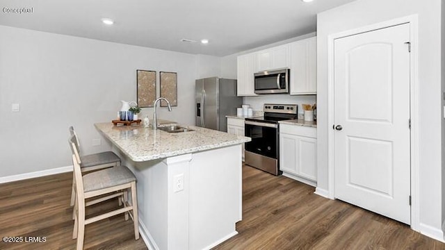 5 Veil Dr, Ridgeland, SC 29936 - kitchen with appliances with stainless steel finishes, dark wood-style floors, white cabinetry, and recessed lighting