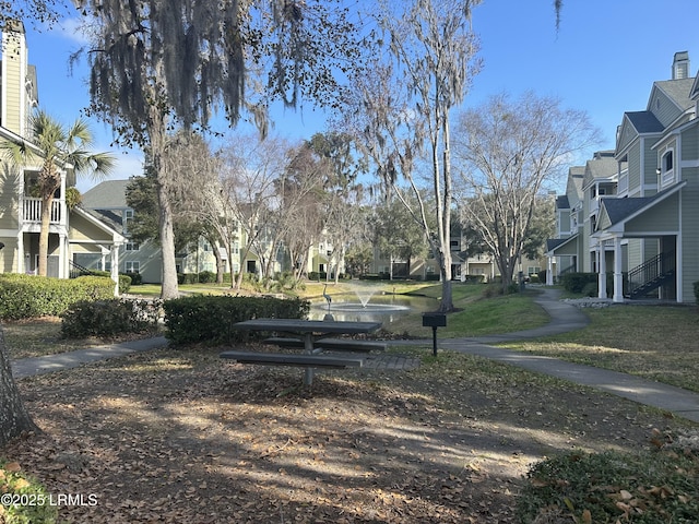 exterior space featuring a residential view and a yard