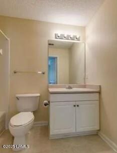 full bath featuring toilet, baseboards, walk in shower, and vanity