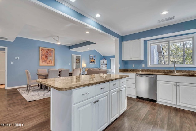 kitchen with a kitchen island, dishwasher, sink, white cabinets, and dark wood-type flooring