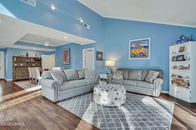 living room with crown molding and hardwood / wood-style flooring