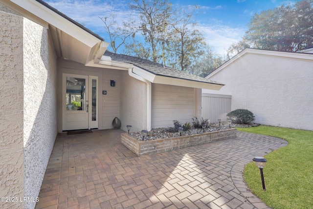 doorway to property featuring a patio area