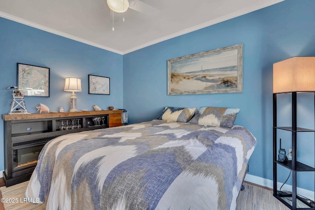 bedroom with ceiling fan, ornamental molding, and light wood-type flooring