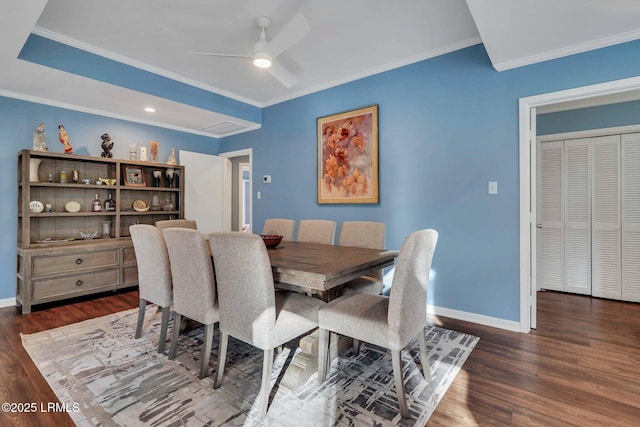 dining room featuring dark hardwood / wood-style flooring, ornamental molding, and ceiling fan