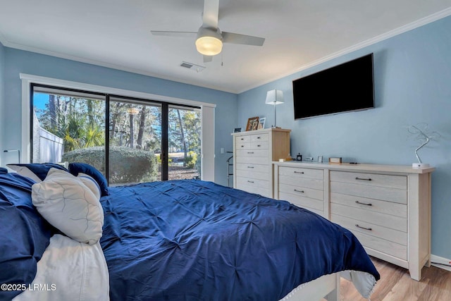 bedroom featuring ornamental molding, access to outside, and light wood-type flooring