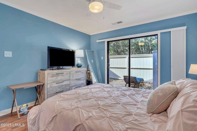 bedroom with crown molding, ceiling fan, hardwood / wood-style floors, and access to outside