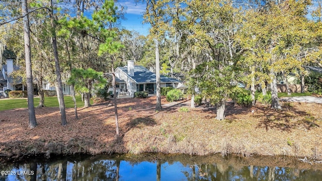 back of house with a water view