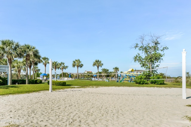 view of community featuring a lawn and volleyball court