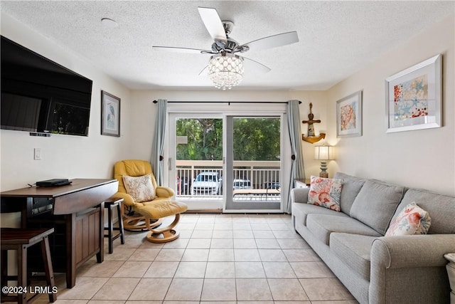 tiled living room with a textured ceiling and ceiling fan