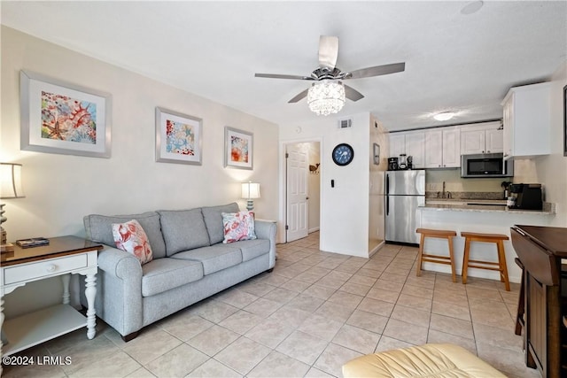 living room with light tile patterned flooring and ceiling fan