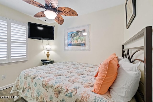 bedroom featuring wood-type flooring and ceiling fan