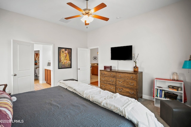 bedroom featuring connected bathroom, light colored carpet, a ceiling fan, visible vents, and baseboards