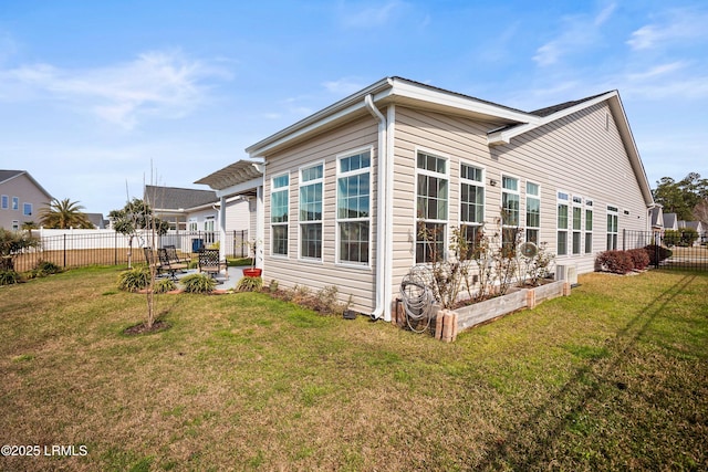 view of home's exterior featuring a patio area, fence, and a yard