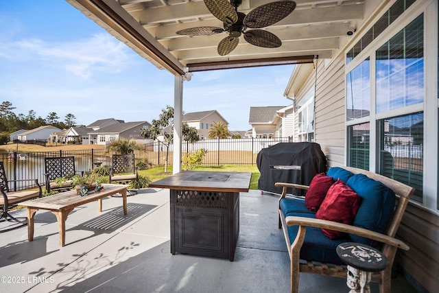 view of patio / terrace featuring ceiling fan, a fenced backyard, area for grilling, an outdoor living space, and a residential view