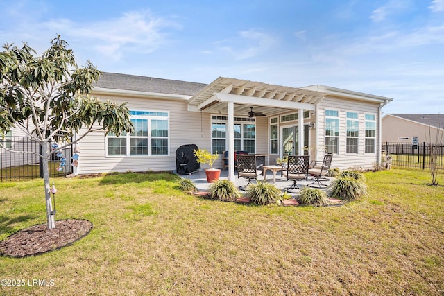 rear view of house featuring a lawn, fence, a patio, and a pergola