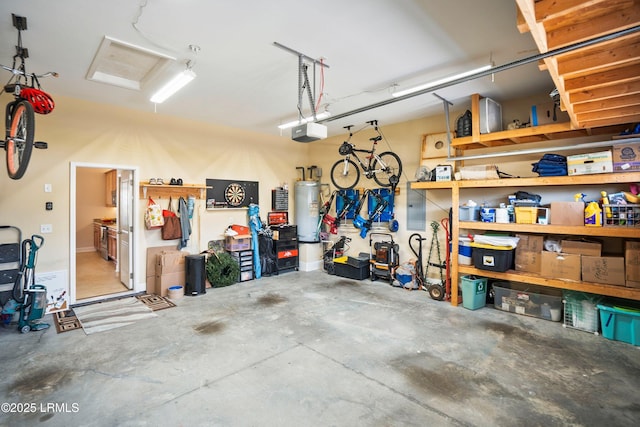 garage featuring gas water heater and a garage door opener