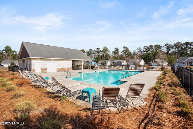 pool featuring a patio area and fence