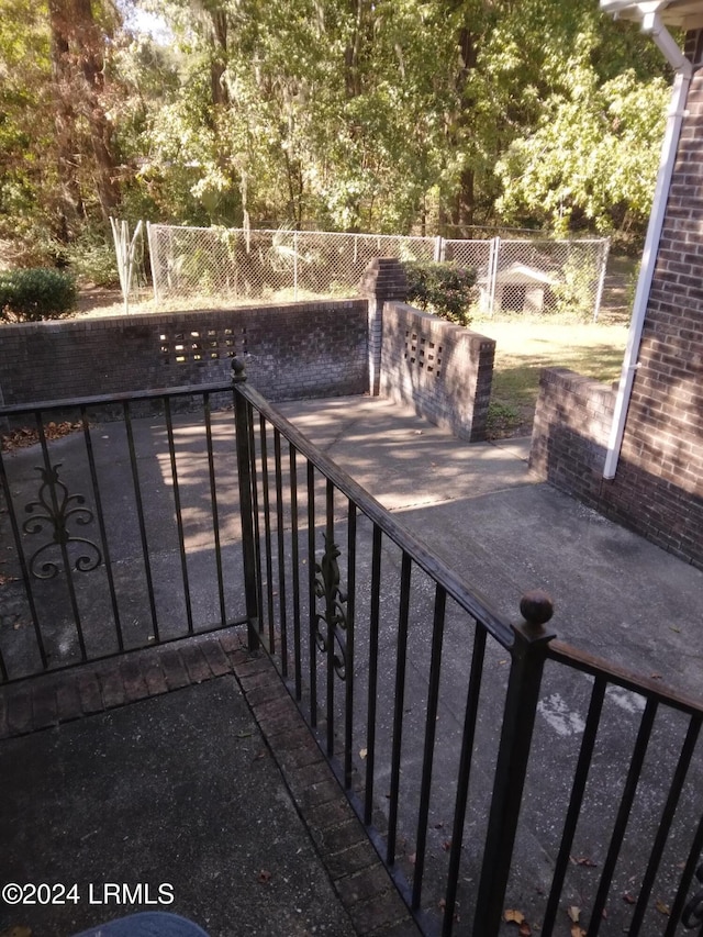 view of patio featuring fence