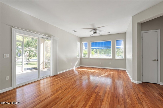 empty room featuring light hardwood / wood-style flooring and ceiling fan