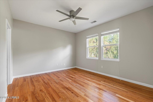 empty room featuring light hardwood / wood-style flooring and ceiling fan