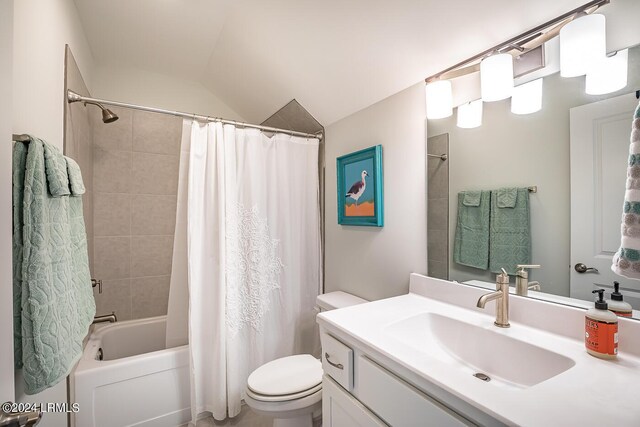 full bathroom featuring lofted ceiling, vanity, shower / bath combo, and toilet