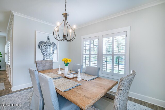 dining space featuring crown molding, dark hardwood / wood-style floors, and an inviting chandelier