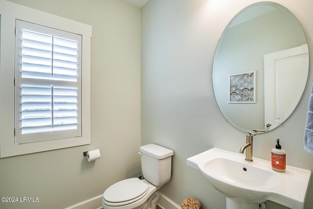 bathroom with toilet and sink