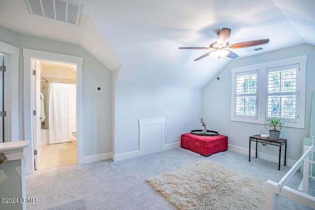 bonus room featuring vaulted ceiling, light colored carpet, and ceiling fan