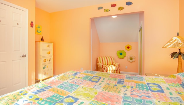 bedroom featuring vaulted ceiling