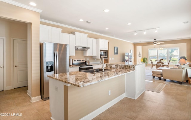 kitchen with white cabinetry, sink, a large island with sink, stainless steel appliances, and light stone countertops