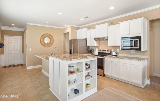 kitchen featuring light stone countertops, white cabinetry, appliances with stainless steel finishes, and a kitchen island with sink