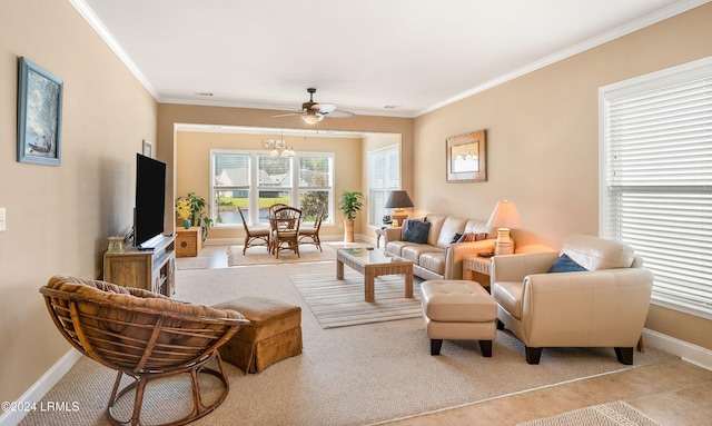 living room featuring ceiling fan and ornamental molding