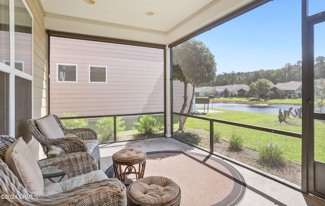 sunroom with a water view