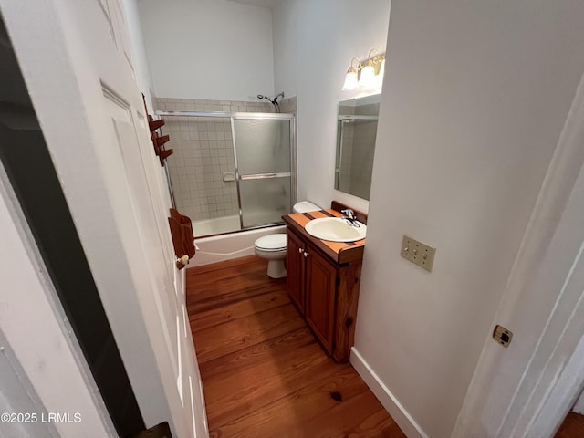 3769 Rice Shire Rd, Ridgeland, SC 29936 - bathroom featuring wood finished floors, vanity, and enclosed tub / shower combo