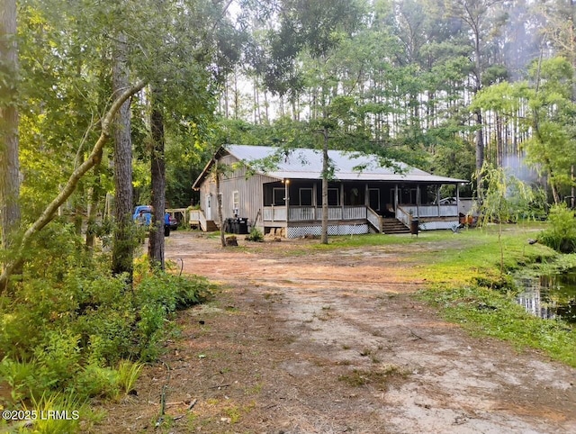 3769 Rice Shire Rd, Ridgeland, SC 29936 - view of front of property featuring driveway, covered porch, and a metal roof