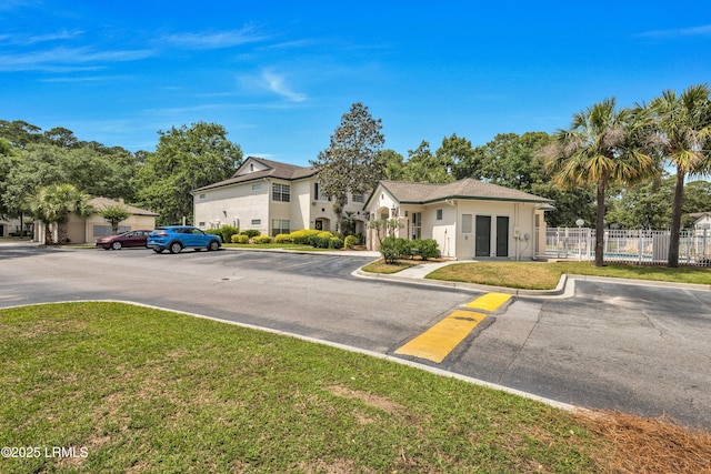 897 Fording Island Rd Unit 2708, Bluffton, SC 29910 - view of front of house featuring uncovered parking and stucco siding