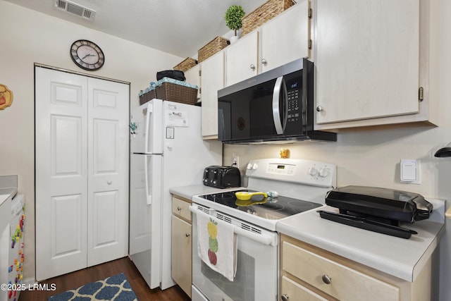 897 Fording Island Rd Unit 2708, Bluffton, SC 29910 - kitchen featuring white appliances, light countertops, and dark wood-type flooring