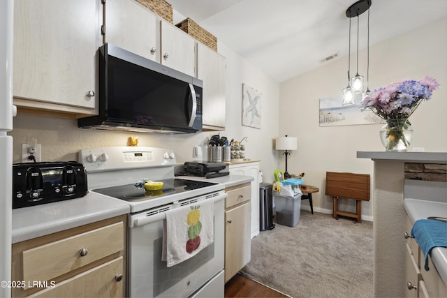 897 Fording Island Rd Unit 2708, Bluffton, SC 29910 - kitchen with stainless steel microwave, white range with electric stovetop, vaulted ceiling, light countertops, and pendant lighting