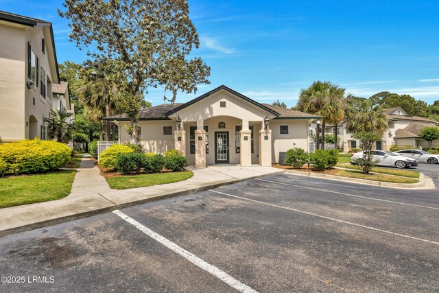 897 Fording Island Rd Unit 2708, Bluffton, SC 29910 - view of front of house featuring uncovered parking and stucco siding