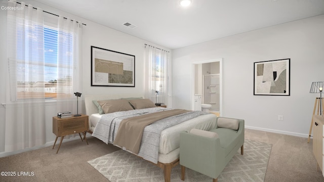 1449 Sanctum St, Ridgeland, SC 29936 - bedroom with multiple windows, light colored carpet, baseboards, and connected bathroom