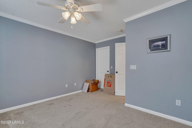 unfurnished bedroom featuring ceiling fan, ornamental molding, and light carpet